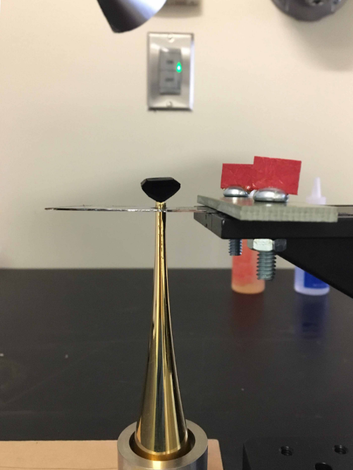 The diamond is attached to the golden foot and the next step will be the removal (breaking) of a Silicon support piece (pictured below the black diamond).